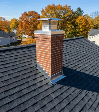 After: new red brick chimney with a stainless cap and bright flashing